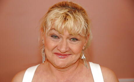 Lovely granny Pattie reveals her ass in nice skirt and spreading her legs 